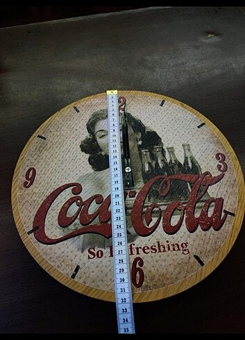 Diğer Coca Cola orijinal duvar saati.