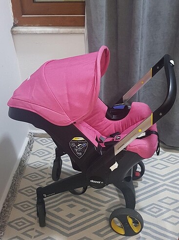 Doona pembe bebek arabası