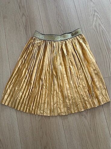 Beli lastikli pileli gold etek