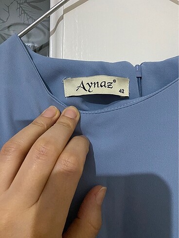 42 Beden mavi Renk Kolları inci detaylı tunik.