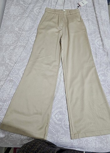 34 Beden ten rengi Renk İspanyol paça bej kumaş pantalon