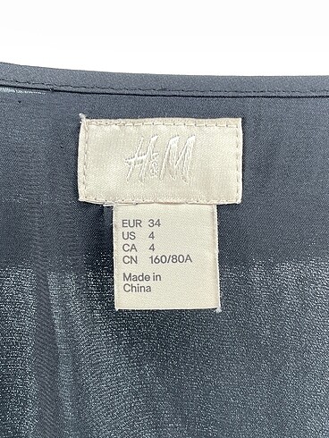 34 Beden siyah Renk H&M Uzun Elbise %70 İndirimli.