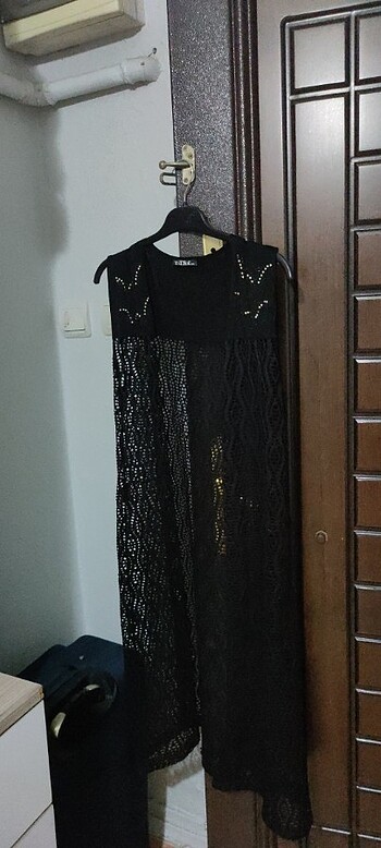 Uzun delikli model yelek boy 102 cm en 46 cm Yeni gibi 